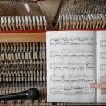 music book on a wooden piano